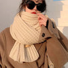 Solid color chunky scarf, an essential accessory for cold weather.
