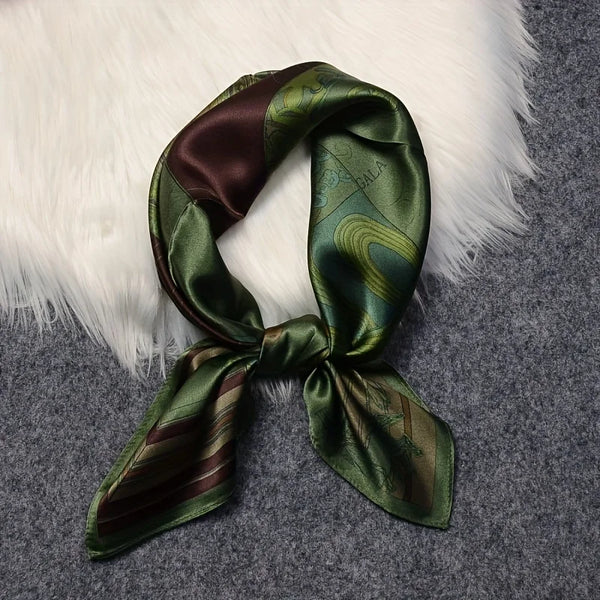 Elegant green satin scarf with unique print, perfect for all seasons.