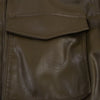 Chic army green faux leather jacket for women with stand collar, loose fit, and functional pockets for winter style.