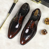 Top-down view of sleek leather Oxfords highlighting the pointed toe design.