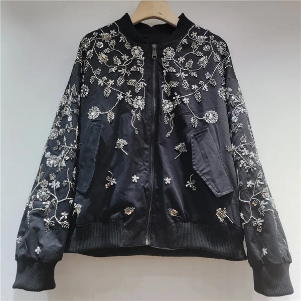 Flat lay of complete embroidered sequin jacket with all design elements visible