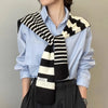 Chic striped knit scarf for women in soft polyester, perfect for spring and autumn.