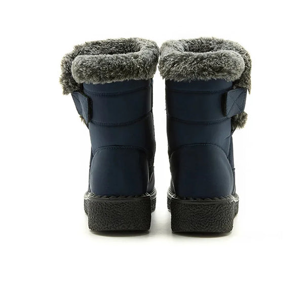 Chic women's waterproof winter boots with plush lining, low heel, and hook-and-loop closure for stylish cold weather comfort.