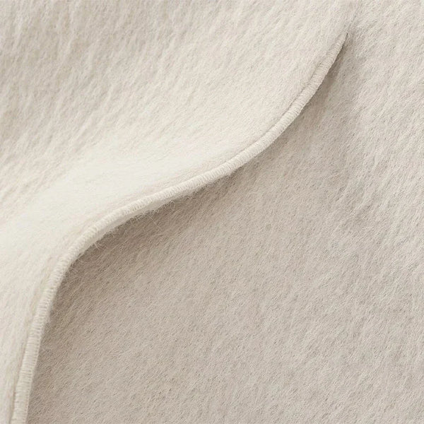 Creamy white mohair blazer styled with flowing skirt for elegant weekend outfit