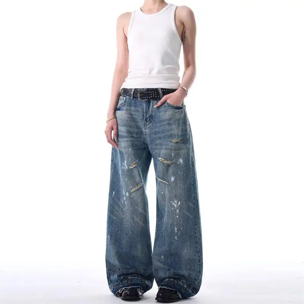 Trendy washed and ripped wide-leg women's jeans with distressed ink-splashed finish for a stylish, comfortable fit.