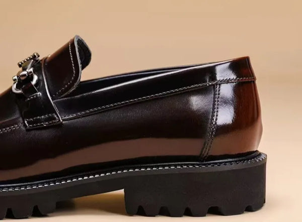 Black Oxfords with a refined buckle, perfect for formal occasions.