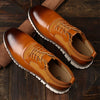 Close-up of black men's brogue shoes showcasing intricate detailing.