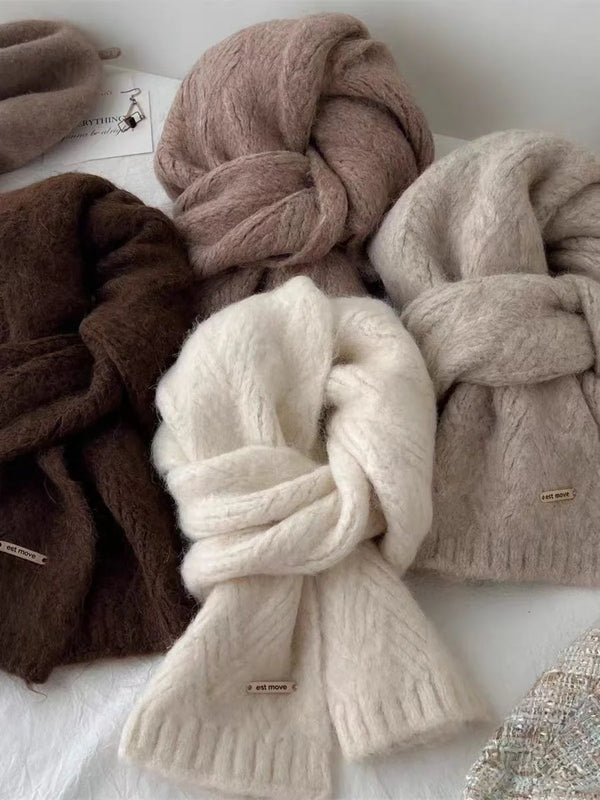 Cozy women's scarf wrapped around shoulders, demonstrating its luxurious warmth and comfort.