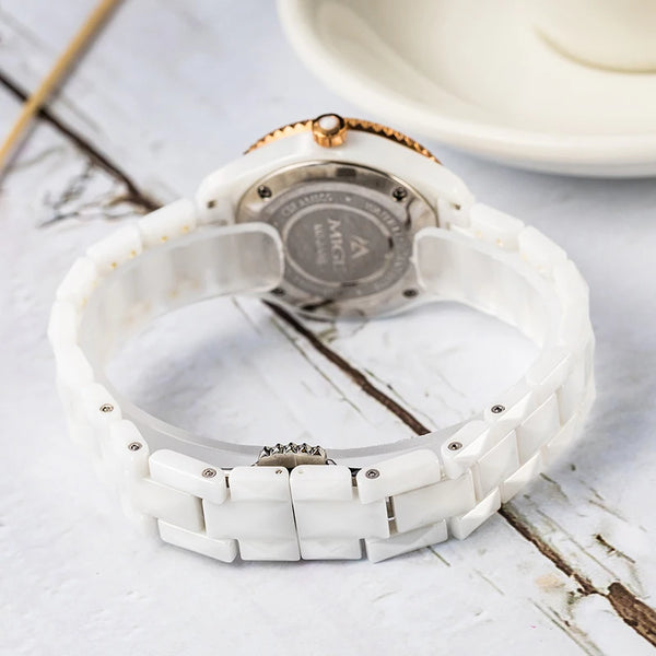 Elegant women's watch featuring a seamless rose gold finish and ceramic band.