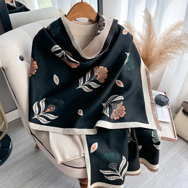 Elegant scarf with a vibrant leaf print, perfect for cold-weather fashion needs.