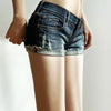 Women's casual denim shorts with elastic waist detail and button-zip front