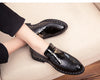 Men's dress shoes featuring a sleek patent leather finish.