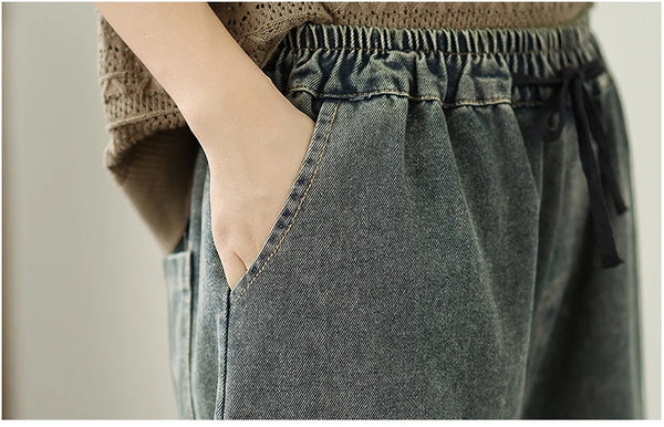 Vintage embroidered wide-leg jeans for women, featuring elastic waist, ethnic embroidery, and light wash for autumn fashion.