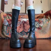 Chic black platform knee-high fashion boots with wedge heel, waterproof design, and bling accents for stylish women.