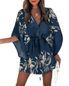 Close-up of V-neckline and button detailing on floral polyester jersey boho dress