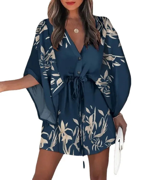Close-up of V-neckline and button detailing on floral polyester jersey boho dress