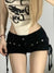 Back view of Y2K inspired lace-up shorts with rivet accents and flattering regular-pant silhouette