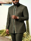 Vibrant African patchwork two-piece in polyester featuring bold geometric and traditional patterns