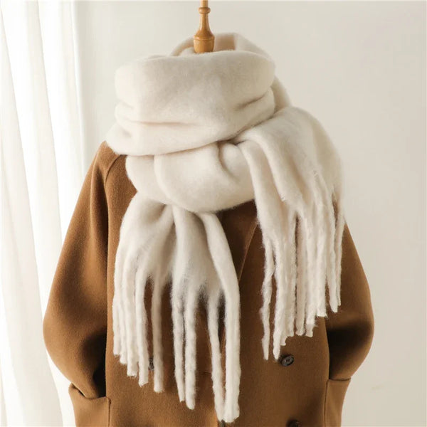 Luxurious cashmere-feel winter scarf in soft gray with large tassels.