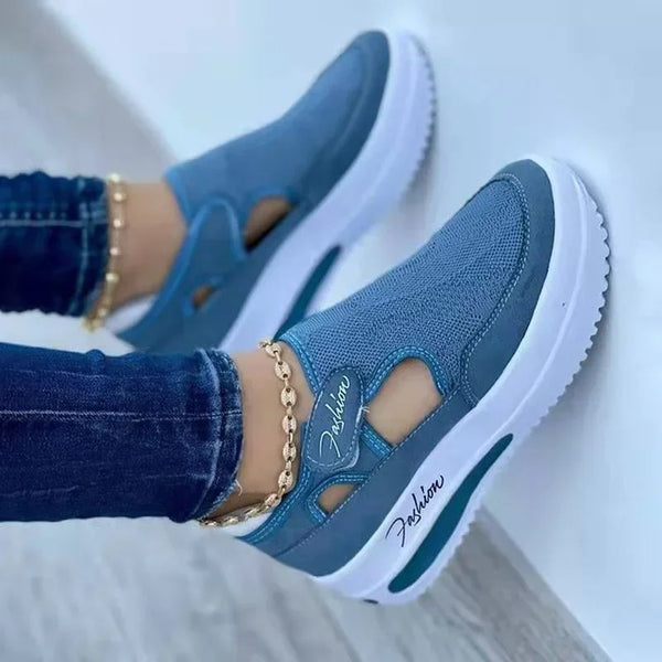 Women's casual white sneakers featuring breathable mesh and low-profile platform