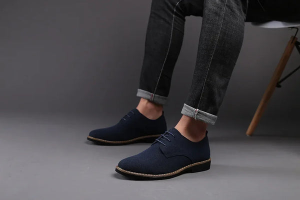 Matte leather dress shoes with a classic floral pattern.