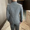 Detail of the suit's tailored fit, emphasizing a flattering silhouette.