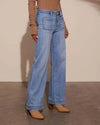 Chic high-waisted wide-leg jeans for women, featuring a relaxed fit, distressed details, and practical pockets for stylish co
