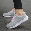 Comfortable white athletic shoes featuring multi-color design for women
