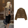 Chic women's leather jacket with button closure, lapel collar, and short length for stylish urban fashion and versatility.