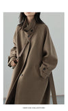 Sophisticated woolen outerwear with cinched waist and long elegant silhouette