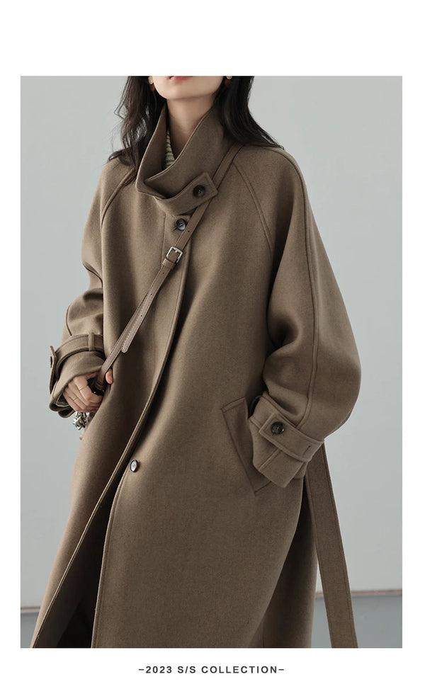 Sophisticated woolen outerwear with cinched waist and long elegant silhouette