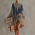 Season-to-season mini dress with elegant drape and whimsical asymmetric cut