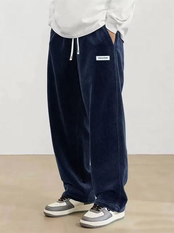 Casual men's corduroy pants with drawstring closure and elastic waistband for adjustable comfort