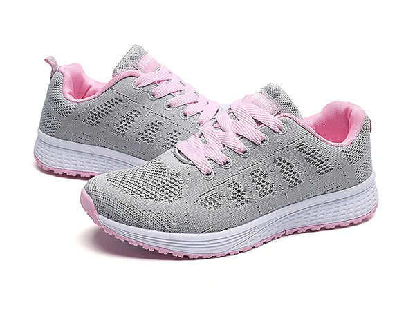 White sports sneakers with breathable mesh and rainbow color details