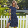 Knee length polka dot dress with elegant pleated design