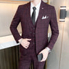 Three-piece suit in British grid pattern, perfect for boardroom and banquet events.