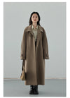 Polished trench coat showcasing belted waist and warm turtleneck design