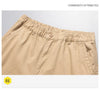 Versatile cargo pants featuring elastic waistband and military-style pockets
