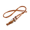 Bohemian braided faux leather skinny belt for women in camel, perfect for casual and formal outfits with fringe accents.