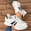 Breathable white sneakers with colorful patchwork accents for women