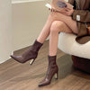 Chic black ankle boots with slim high heels, pointed toe design, perfect for autumn and winter fashion.