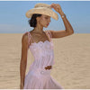 Woman in elegant lace ensemble at summer evening event