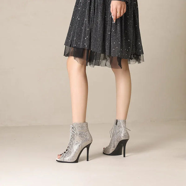 Back view of snake-print ankle boots showing zip closure detail