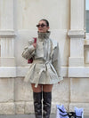 Khaki trench coat with stand collar and double-breasted button front on white background