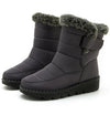 Chic women's waterproof winter boots with plush lining, low heel, and secure hook-and-loop closure for cold weather comfort.