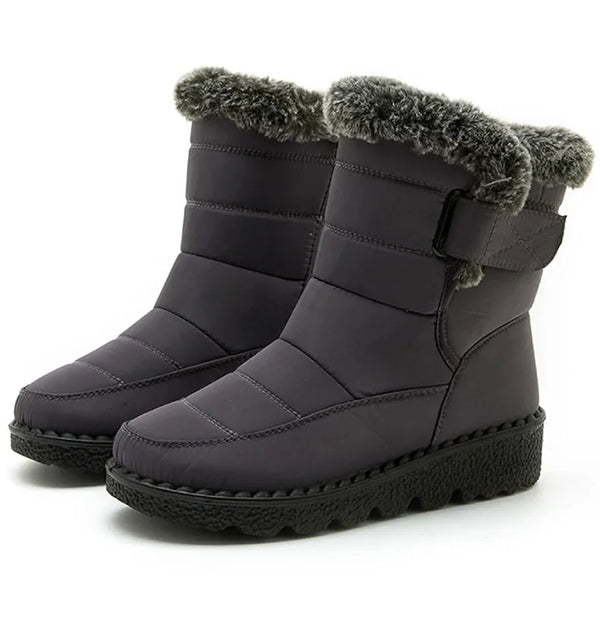 Chic women's waterproof winter boots with plush lining, low heel, and secure hook-and-loop closure for cold weather comfort.