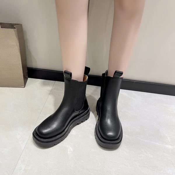 Chic women's Chelsea boots with thick sole, slip-on design, and durable rubber outsole for stylish autumn and spring wear.