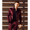 Elegant two-piece satin suit displayed with accessories for a complete formal look.