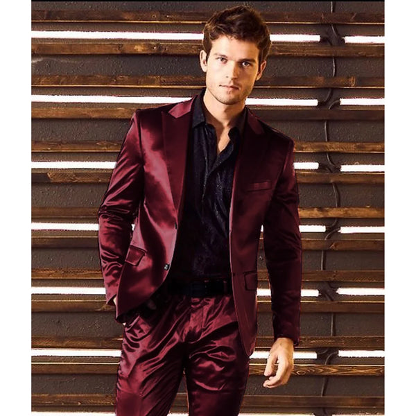 Elegant two-piece satin suit displayed with accessories for a complete formal look.