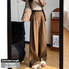 Detail shot of corduroy ridge texture and quality fabric construction on wide leg pants